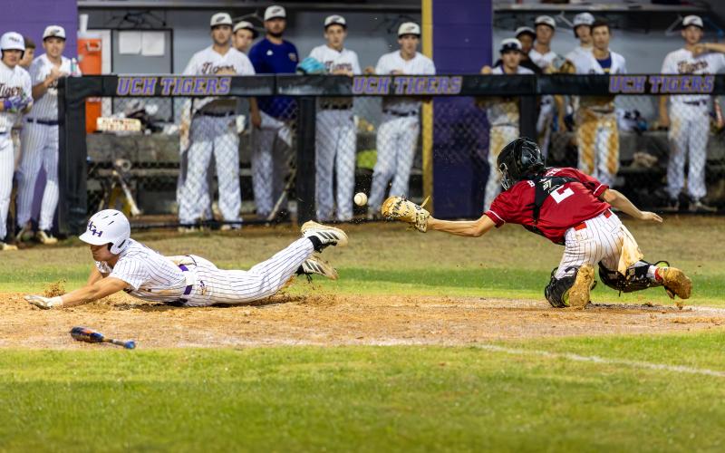 Lafayette catcher Brayden Richardson can't reel in a throw as Union County scores a run during Game 1 of the Region 3-R finals on Friday. (JACK HOWDESHELL/Lake City Reporter)