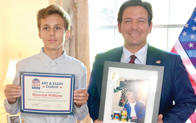 Fort White Middle School student Maverick Williams won a state essay contest on ‘Celebrating Florida’s Contributions to America’ for his entry on Dr. James Cade, the founder of Gatorade. Williams won a two-year scholarship as well as a picture of Cade from Gov. Ron DeSantis in the contest. (COURTESY)