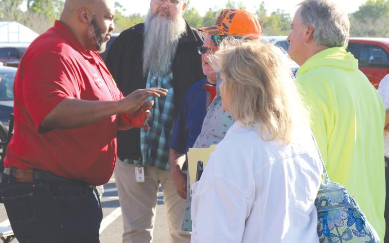 State Sen. Corey Simon (left) speaks with Water First North Florida meeting attendees outside the UF/IFAS North Florida Research and Education Center Suwannee Valley’s educational pavilion in March. (FILE)