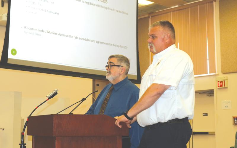Columbia County Fire Rescue Assistant Chief Lance Hill (right) and County Manager David Kraus discussed the importance of EMS services in the county during the County Commission’s meeting on Thursday. (TONY BRITT/Lake City Reporter)