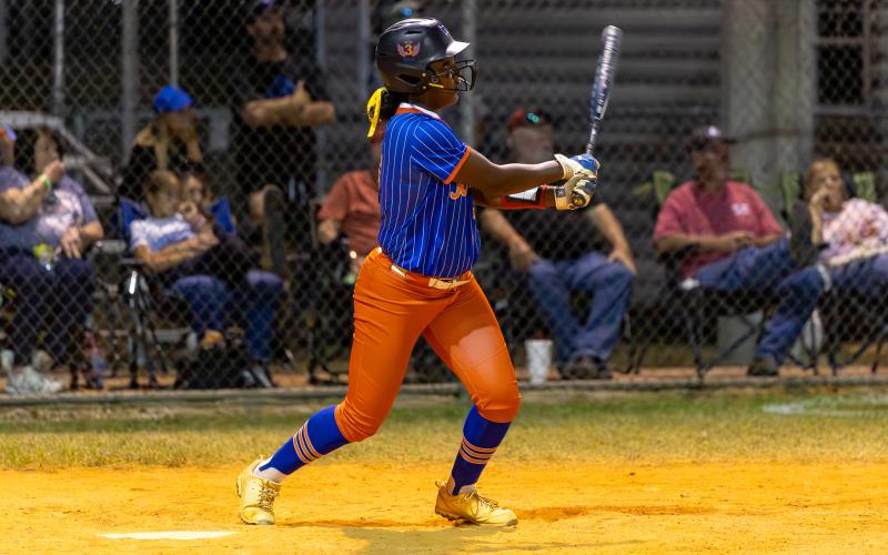 Branford first baseman Mallory Blue watches her home run soar over the fence against Fort White during the District 6-R semifinals on April 28. (JACK HOWDESHELL/Lake City Reporter)