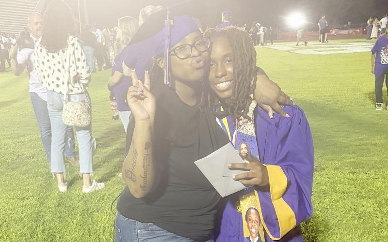 Zacariah Williams (left) was able to surprise her sister Rajaeh at Columbia High’s graduation on Friday, making a special moment for both. (COURTESY)