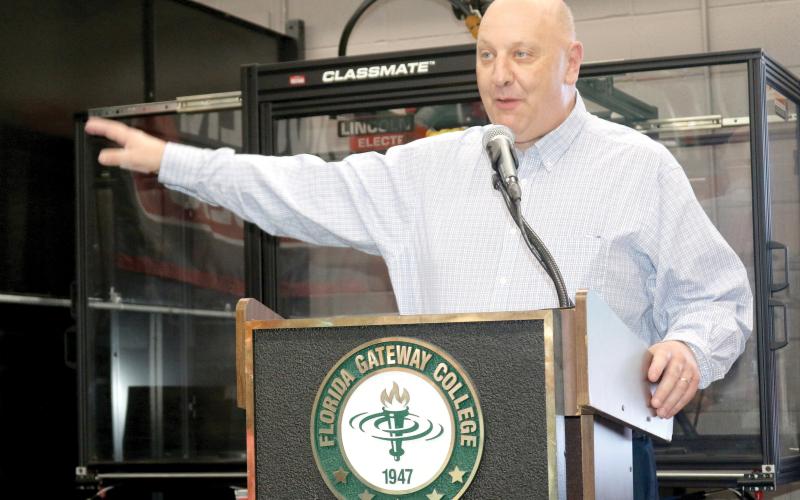 Florida Gateway College President Larry Barrett, speaking at the grand opening of the college’s renovated welding facility earlier this month, received a nearly perfect evaluation from the school’s Board of Trustees. (TONY BRITT/Lake City Reporter)