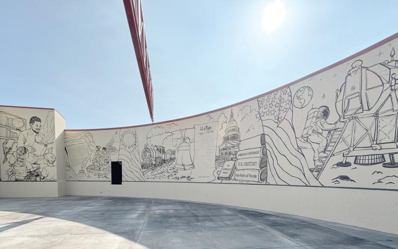 The mural on the outside of the Columbia County Public Library’s West Branch that commemorates 250 years of American history. The mural, which still needs to be colorized, was funded by a state grant. (JAMIE WACHTER/Lake City Reporter)