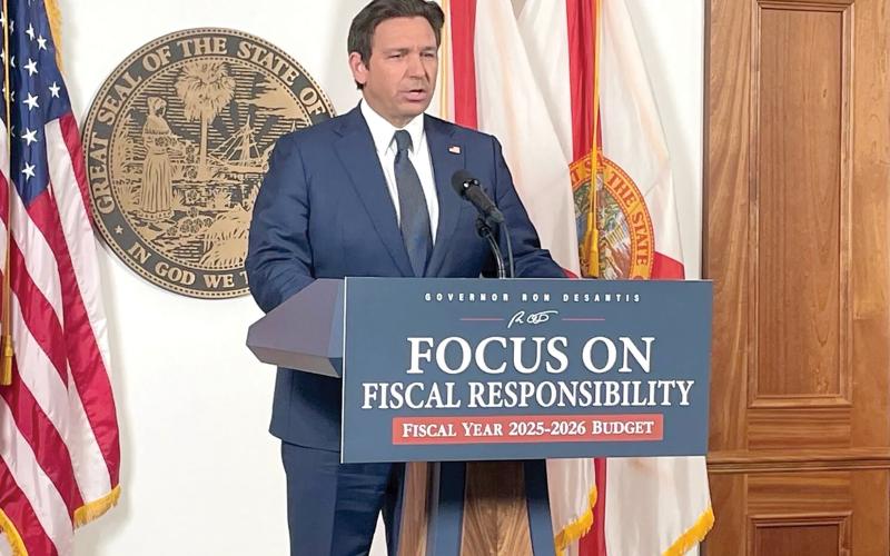 Gov. Ron DeSantis, shown releasing his proposed budget, signed the budget Monday, vetoing more than $800 million from the $117.6 billion plan. (NEWS SERVICE OF FLORIDA FILE)