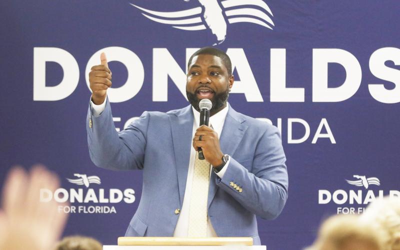Byron Donalds, a U.S. Representative who is running for governor of Florida, speaks Saturday at a rally in Mason City. (JAMIE WACHTER/Lake City Reporter)