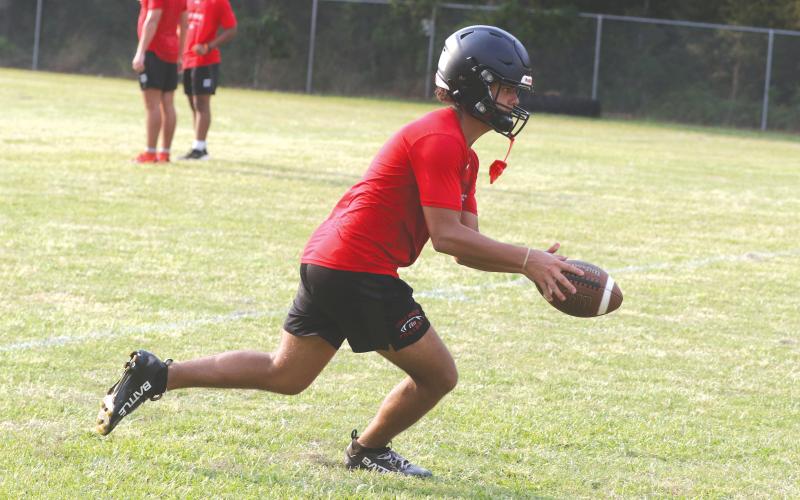 Fort White receiver Javion Bailem makes a bobbling catch at the first day of fall practice Monday. (MORGAN MCMULLEN/Lake City Reporter)