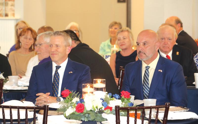 Former Florida Speaker of the House and gubernatorial candidate Paul Renner (left) and Chief Financial Officer Blaise Ingoglia listen during Thusday’s Lincoln/Reagan Dinner fundraiser. (TONY BRITT/Lake City Reporter)