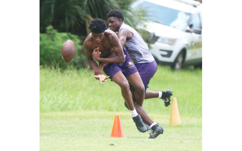 Columbia defensive back Monterrence Williamson breaks up a pass intended for receiver Shaheed White in 7-on-7 drills during Tuesday’s summer workout. (JORDAN KROEGER/Lake City Reporter)