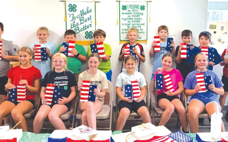Lafayette County 4-H Camp USA campers display their patriotic crafts. Campers were able to learn about the rights, responsibilities and opportunities that come with being an American citizen. (COURTESY LAFAYETTE COUNTY 4-H)
