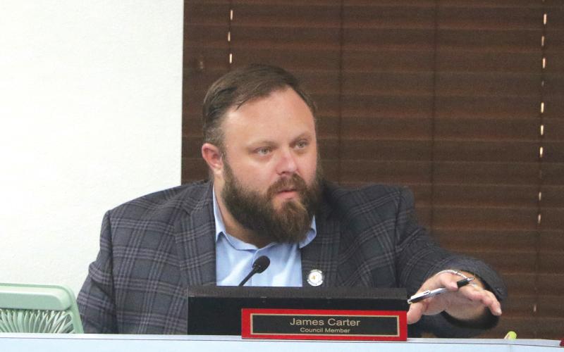 Lake City Councilman James Carter speaks during Monday’s council meeting. Carter recused himself from a vote on public benches due to his presidency with the Kiwanis Club of Lake City, which benefits through a grant program for the upkeep and maintenance of the benches. (MORGAN MCMULLEN/Lake City Reporter)