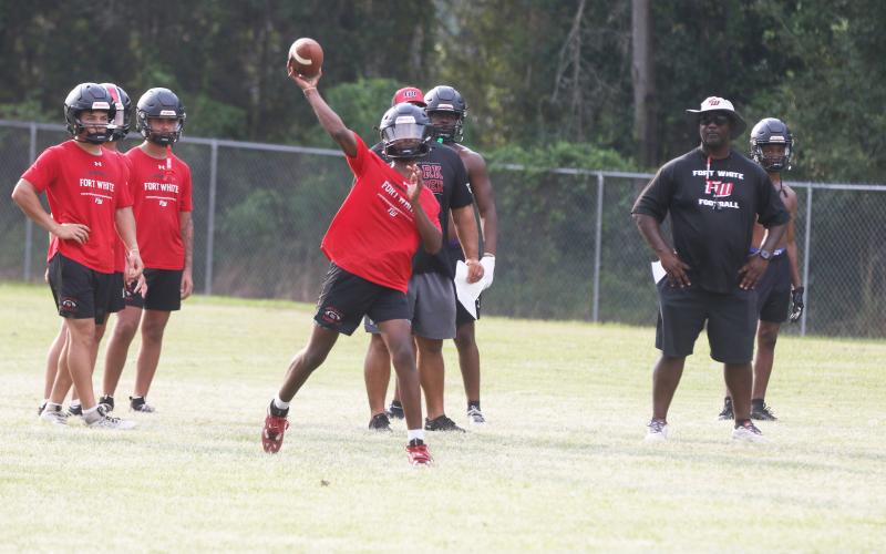 Fort White quarterback Chance Johnson throws a pass during Monday’s practice. (MORGAN MCMULLEN/Lake City Reporter)