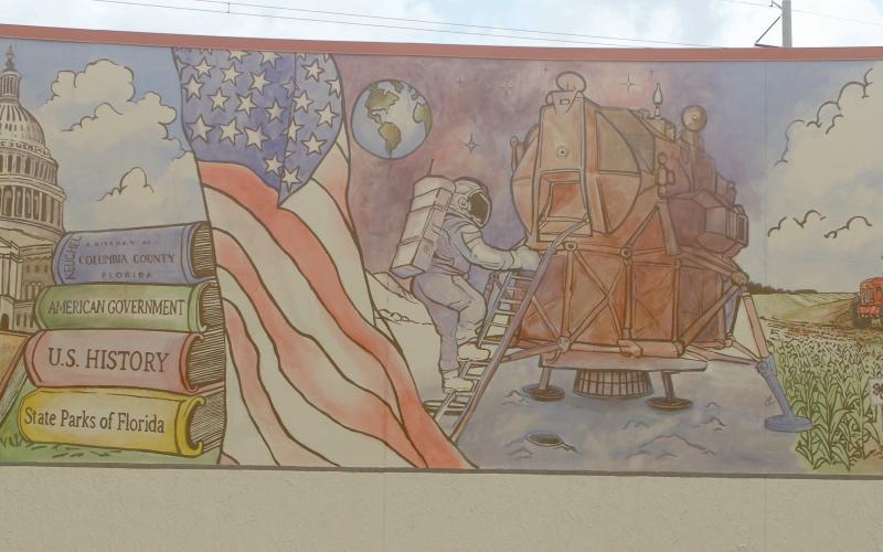 The mural by Cosby Hayes on the outside of the Columbia County Public Library’s West Branch detailing America’s history is now completed after Hayes added color to the various scenes from the past 250 years. (JAMIE WACHTER/Lake City Reporter)