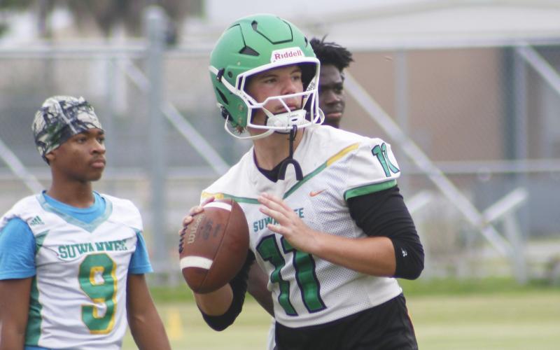 Suwannee quarterback Haigen Johnson drops back to pass during practice on Monday. (JAMIE WACHTER/Lake City Reporter)