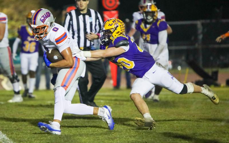 Columbia linebacker Bryson Grinstead tries to chase down Bolles running back Xander Edwards on Oct 31, 2025. (FILE)