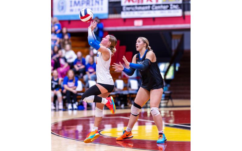 Branford libero Ava Alcorn (left) defends a shot while outside hitter Anabella Dicks looks on against Chipley during last season’s Class Rural state championship. Alcorn and Dicks are the only returning starters for the Buccaneers this season. (JACK HOWDESHELL/Lake City Reporter)