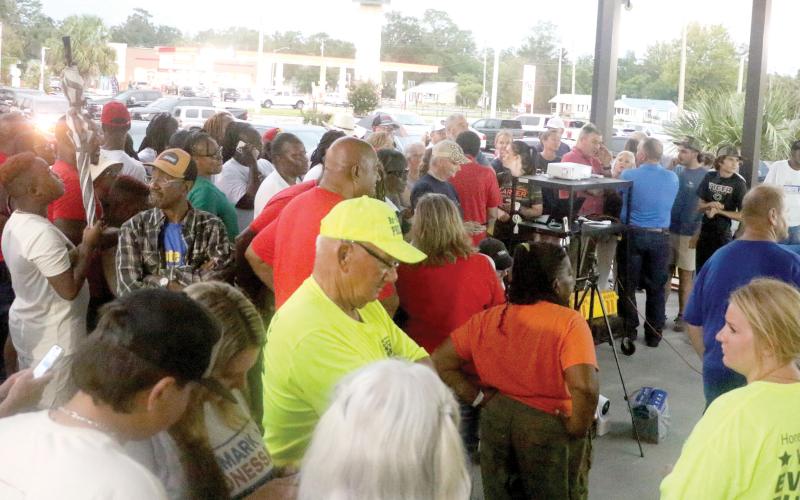 Candidates, supporters and other interested local residents wait outside the Supervisor of Elections Office on Tuesday night for results to come in from the primary election. (MORGAN MCMULLEN/Lake City Reporter)