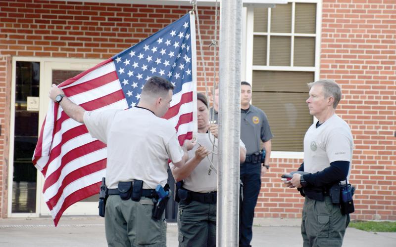Florida Gateway College students raise the flag at the FGC Public Safety Training Center in Olustee. The college has been designated a Purple Star Campus by the Florida Department of Education for service and commitment to supporting military students and families. (COURTESY FLORIDA GATEWAY COLLEGE)