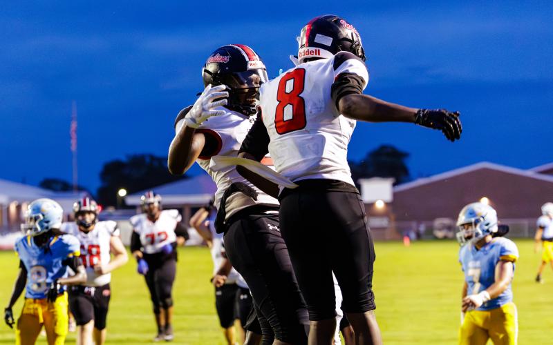 Fort White receiver Jakori Robinson (8) celebrates with receiver Brandon Robinson following a touchdown against Chiefland on Friday. (JACK HOWDESHELL/Lake City Reporter)