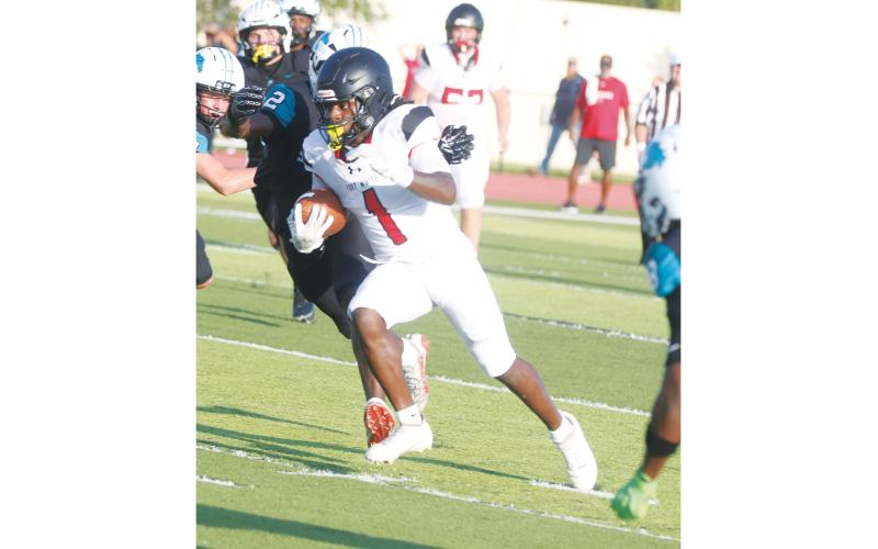 Fort White running back John’l Lawson races up the field for a long run against Providence during the Kickoff Classic on Aug. 14. Lawson is a key returner on offense for the Indians this season. (MORGAN MCMULLEN/Lake City Reporter)