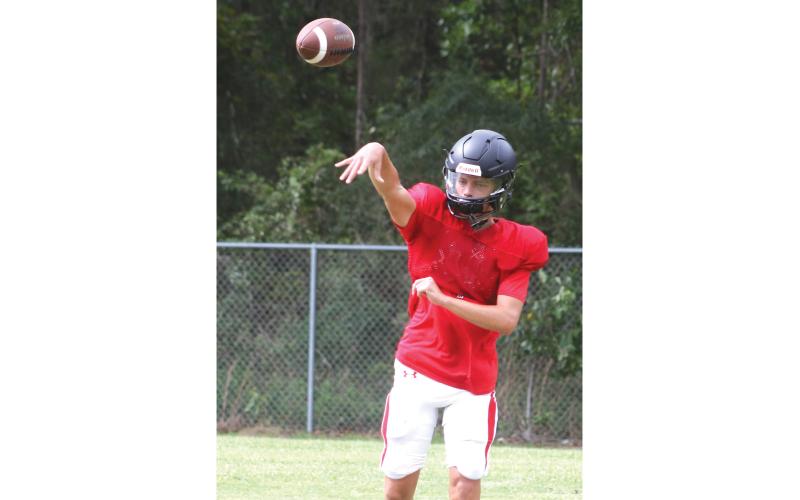 Fort White quarterback Carter Wheeler throws a pass during practice on Aug. 3. (MORGAN MCMULLEN/Lake City Reporter)