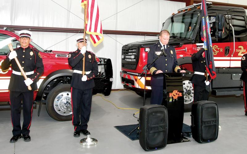 The Suwannee County Fire Rescue Honor Guard stand at attention as Fire Chief Dan Miller prepares to speak at the grand opening of Station 6 on Aug. 19. (ROB WOLFE/Lake City Reporter)