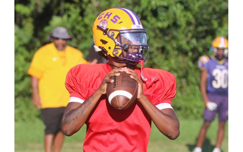 Columbia quarterback Amari Green drops back to pass during Tuesday’s practice. (JORDAN KROEGER/Lake City Reporter)