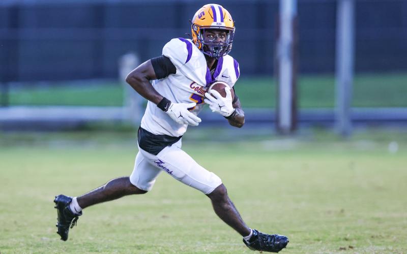 Columbia receiver Kyren Caldwell, a 3-star recruit who is committed to Maryland, turns up the field after a catch against Oakleaf during the Kickoff Classic on Aug. 14. (GARY LLOYD MCCULLOUGH/Special to the Reporter)