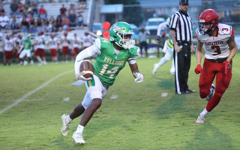 Suwannee defensive back Jarquez Gwinn returns an interception against Lafayette on Friday night. Gwinn had three interceptions in the game. (PAUL BUCHANAN/Lake City Reporter)
