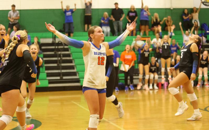 Branford libero Ava Alcorn and her teammates celebrate match point after rallying to defeat Suwannee in five sets Tuesday night. (PAUL BUCHANAN/Lake City Reporter)