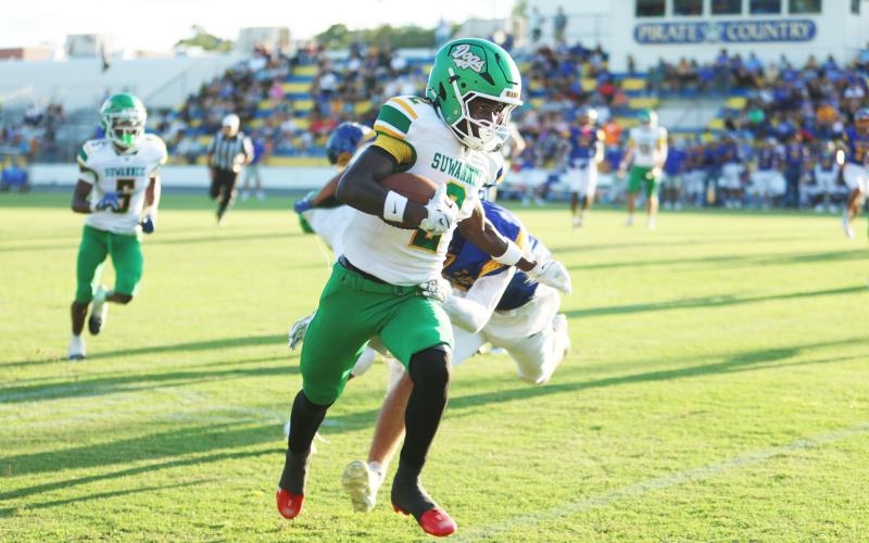 Suwannee receiver Ajari Williams heads to the end zone for a touchdown against Crystal River last Friday. (PAUL BUCHANAN/Lake City Reporter)