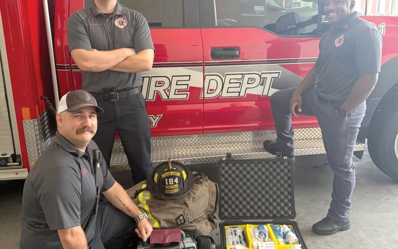 Lake City Fire Department driver/engineer and paramedic Chris Bethea (from left) and firefighters Jayden Britton-Drew and Nate Williams II are pictured with the department’s first Advanced Life Support engine. It went into service Saturday. (COURTESY)