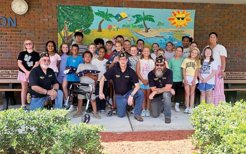 Members of the American Legion Post 57 Honor Guard of Lake City visited Amy Kirkland Smith’s fifth-grade Safety Patrol class Wednesday at Westside Elementary School to provide a lesson on American Flag etiquette. (COURTESY)
