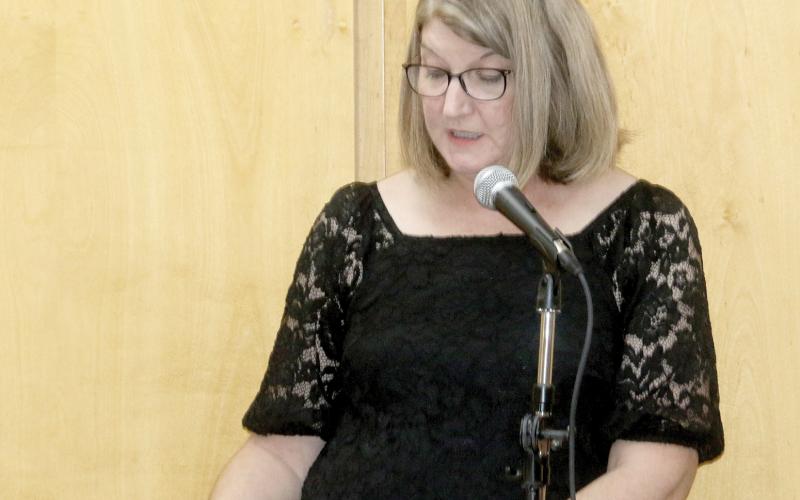 Columbia County Public Library Director Katrina Evans speaks during a previous graduation ceremony for College Online High School students through the library. The program is being relaunched thanks to a a partnership between COHS and Friends of the Library. (FILE)