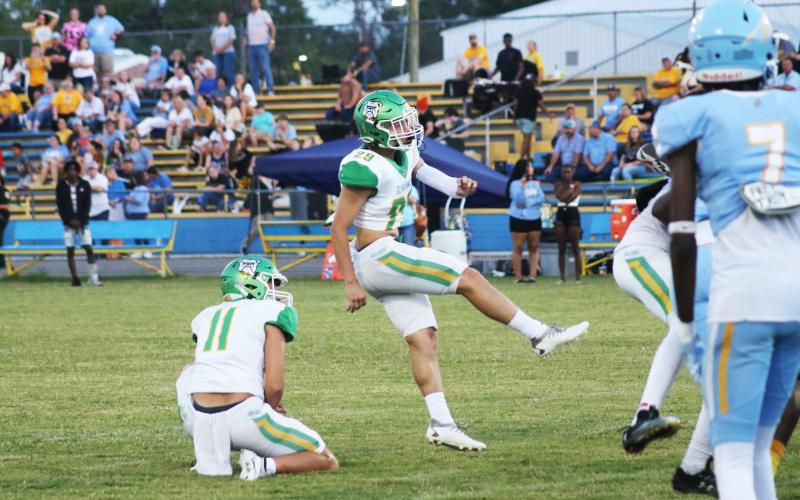 Suwannee kicker Jace Moran knocks through an extra point in 2023. (FILE)