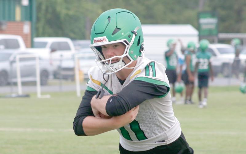Suwannee quarterback Haigen Johnson runs through a drill during the first day of fall practice on July 27. (JAMIE WACHTER/Lake City Reporter)