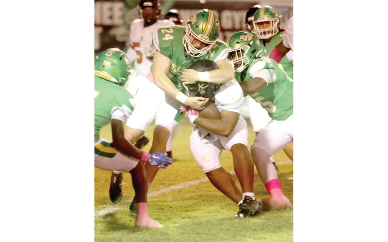 Suwannee linebacker Kyler Watson wraps up an Atlantic Coast ballcarrier last year. (PAUL BUCHANAN/Lake City Reporter)