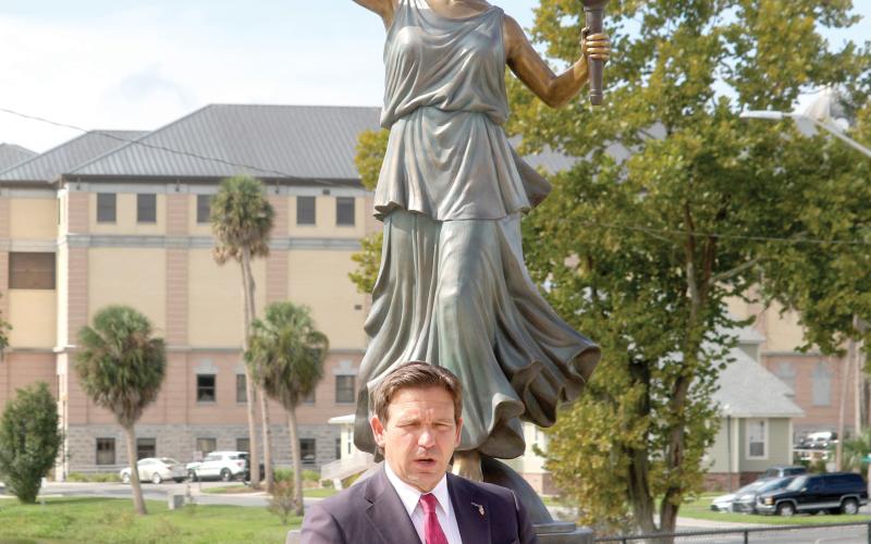 Gov. Ron DeSantis unveiled a statue of Lady Columbia at Darby Pavilion in downtown Lake City on Thursday. DeSantis called Columbia the ‘first national mascot.’ (TONY BRITT/Lake City Reporter)