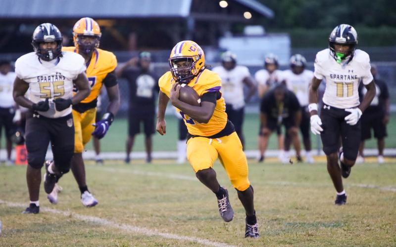 Columbia running back Jerome Horne gets around the corner of the Lakewood defense for a gain on Friday. (BRENT KUYKENDALL/Lake City Reporter)
