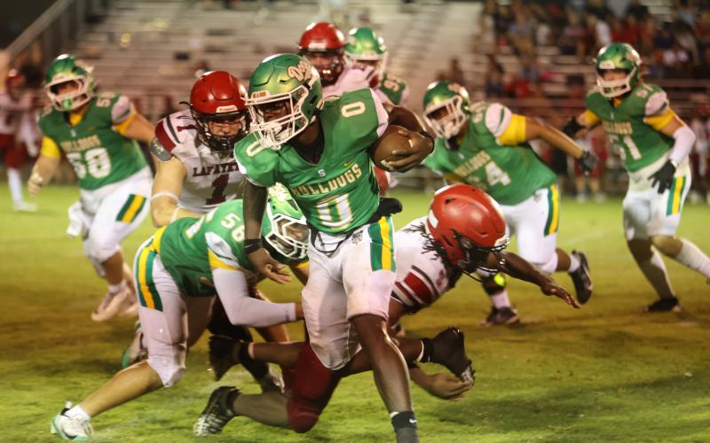 PAUL BUCHANAN/Lake City Reporter Suwannee running back Travon Fead gets around the corner of the Lafayette defense last Friday. (PAUL BUCHANAN/Lake City Reporter)