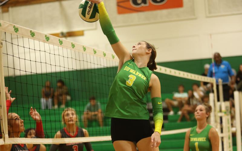 Suwannee hitter Jaylin Nash gets a shot over the net against Lafayette on Tuesday. (PAUL BUCHANAN/Lake City Reporter)