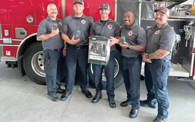 Lake City firefighters Chris Bethea (from left), Jayden Britton-Drew, Hunter Anderson, Mae Williams and Earl Lupardus, show the new gas monitors that were recently purchased by the fire department with grant funds. (COURTESY)