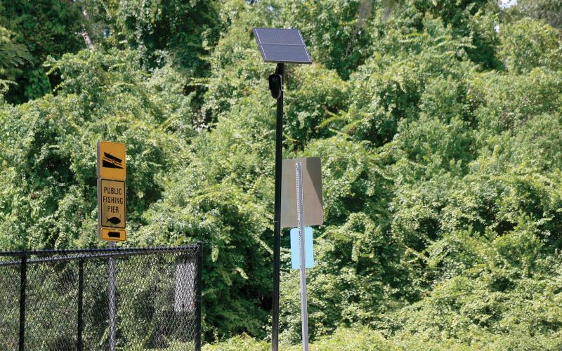 FILE A Flock Safety license plate reader camera sits along Baya Avenue by the entrance to the Lake Montgomery boat ramp. The state is shutting down the use of the cameras on state roads due to privacy concerns. (FILE)