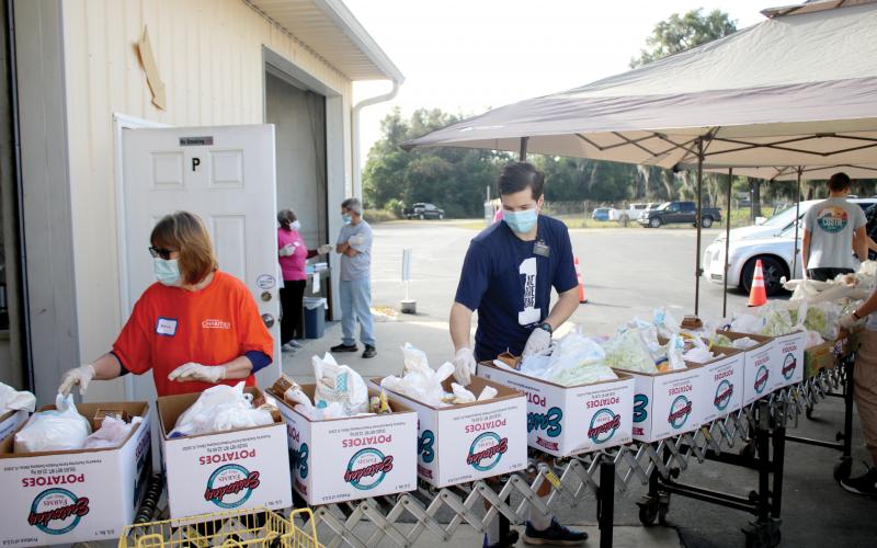 Chain of goodness': Catholic Charities, volunteers hand out 500-plus  Thanksgiving baskets | Lake City Reporter