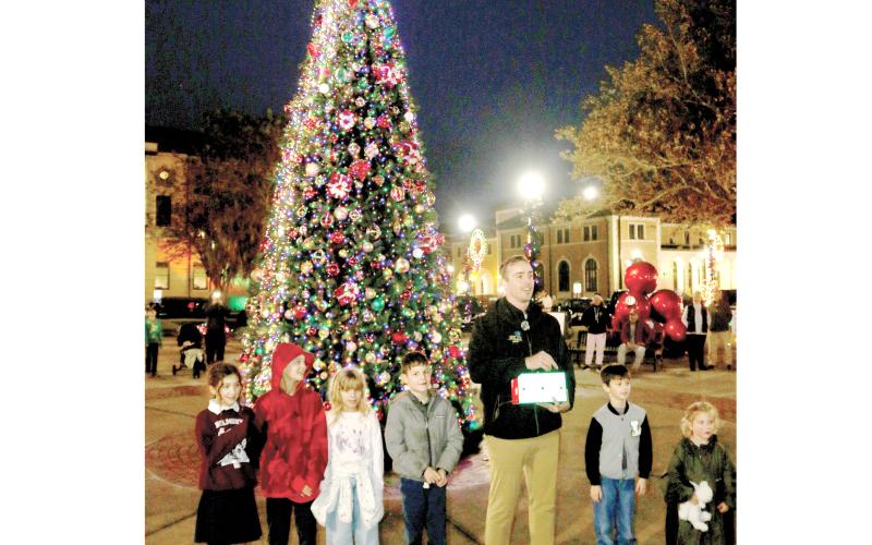Downtown Christmas tree lit in delayed ceremony