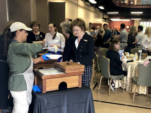Attendees watch their bowls fill at the sixth annual Empty Bowls luncheon Nov. 8. The meal raised thousands of dollars for Barnabas Center’s programs that support Nassau County families in need. 