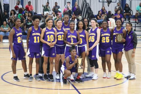 Columbia’s girls basketball team is pictured with the trophy after winning the Hitchcock’s Challenge on Monday. (JORDAN KROEGER/Lake City Reporter)