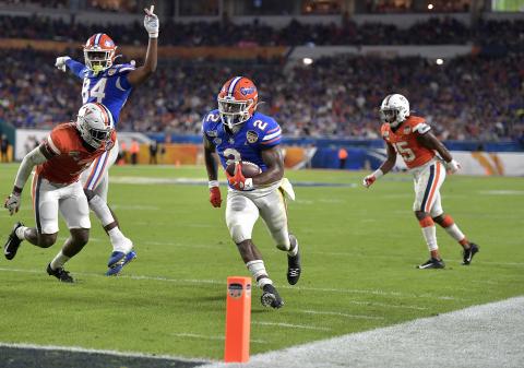 Florida’s Lamical Perine runs to the end zone for a touchdown against Virginia during the first half of the Orange Bowl on Monday, at Hard Rock Stadium. (MICHAEL LAUGHLIN/Sun Sentinel/TNS)