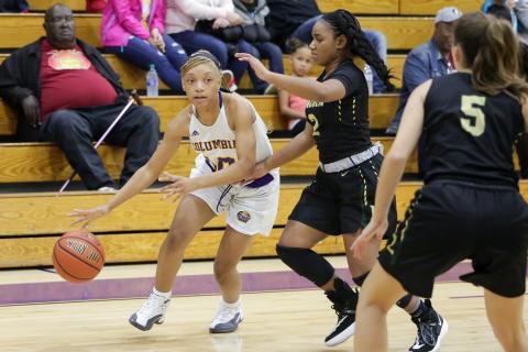 Columbia guard Taylor Ivery looks to drive by Lincoln’s Erin Turral on Dec. 13, 2019. (BRENT KUYKENDALL/Lake City Reporter)