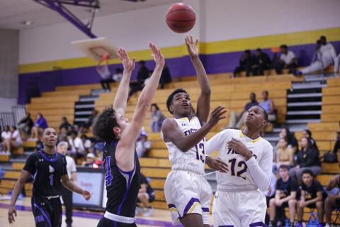 Columbia guard Tray Tolliver puts up a shot in traffic against Saint Francis Catholic on Tuesday night. (BRENT KUYKENDALL/Lake City Reporter)